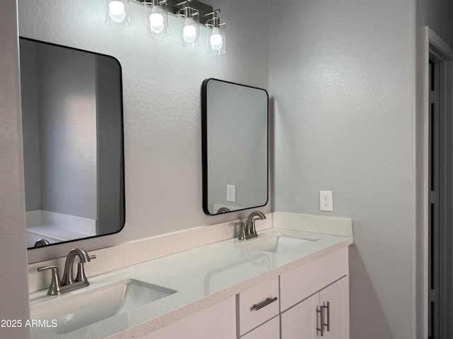 9224 W Raymond St, Tolleson, AZ 85353 - bathroom with double vanity and a textured wall