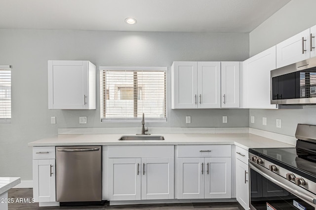 9224 W Raymond St, Tolleson, AZ 85353 - kitchen featuring appliances with stainless steel finishes, white cabinetry, light countertops, and recessed lighting