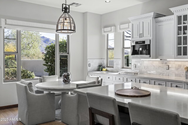 dining space with light hardwood / wood-style flooring