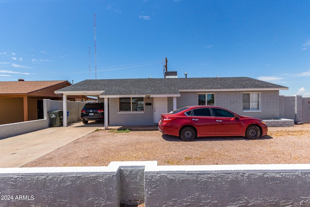 ranch-style house featuring a carport