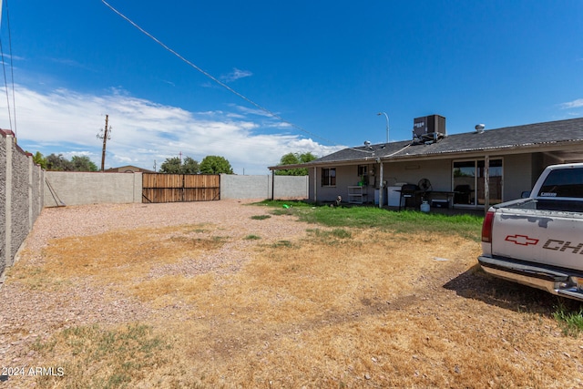 view of yard with central air condition unit