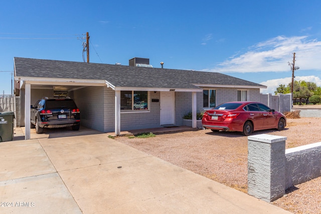 single story home with a carport