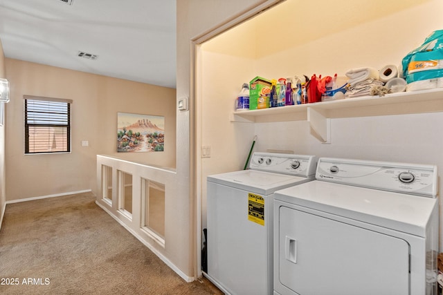 laundry room featuring visible vents, baseboards, light carpet, laundry area, and independent washer and dryer