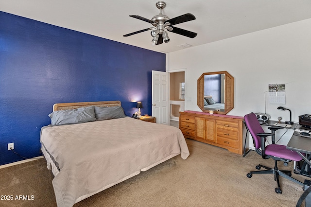 carpeted bedroom with visible vents and a ceiling fan