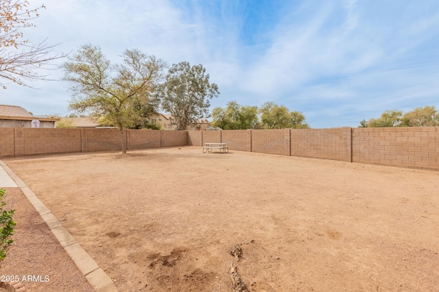 view of yard with a fenced backyard