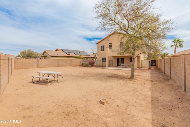 view of yard featuring a patio and a fenced backyard