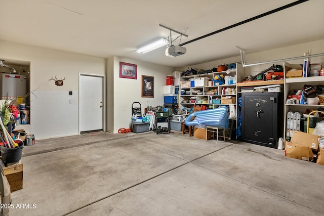 garage with water heater and a garage door opener