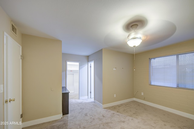 10620 W Clair Dr, Sun City, AZ 85351 - unfurnished room featuring light colored carpet, baseboards, and ceiling fan