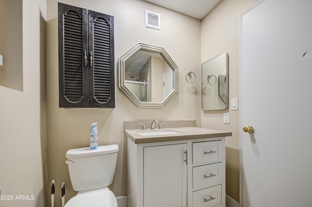 10620 W Clair Dr, Sun City, AZ 85351 - bathroom with toilet and vanity