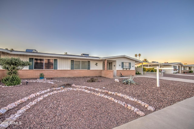 10620 W Clair Dr, Sun City, AZ 85351 - ranch-style house featuring brick siding, fence, and a carport