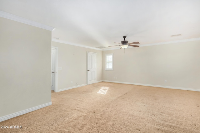 carpeted empty room featuring crown molding and ceiling fan