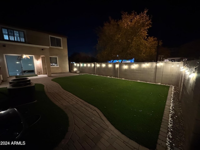 view of yard at night