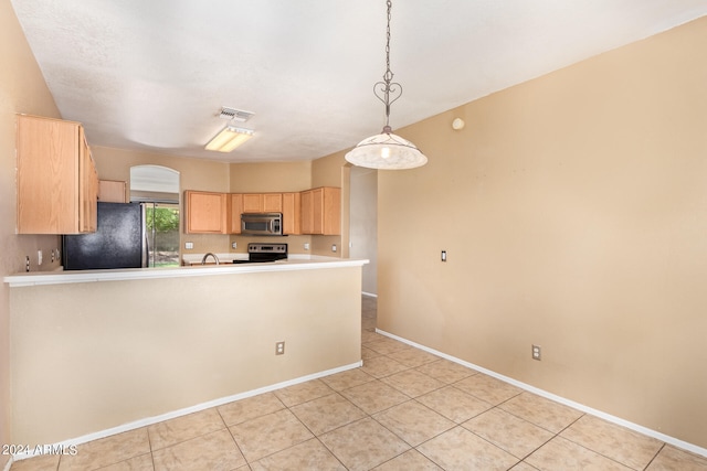 kitchen with light tile patterned floors, appliances with stainless steel finishes, light brown cabinets, kitchen peninsula, and pendant lighting