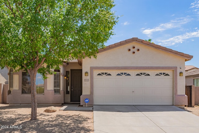 view of front of property with a garage