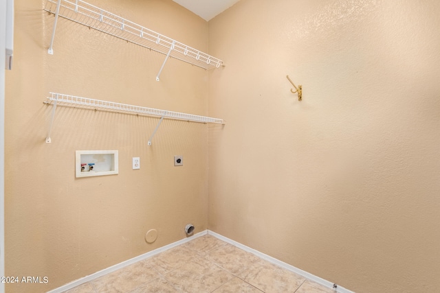 laundry room with washer hookup, gas dryer hookup, light tile patterned floors, and electric dryer hookup