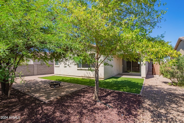 back of house with a patio