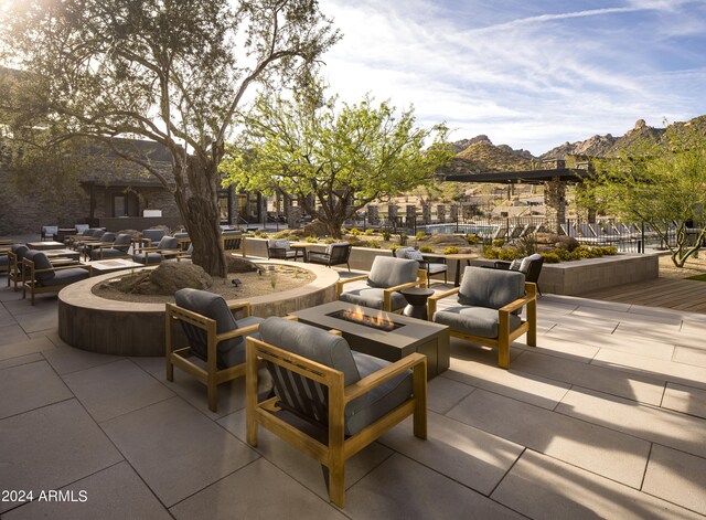 view of patio featuring an outdoor fire pit