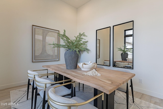 dining space featuring light wood-type flooring