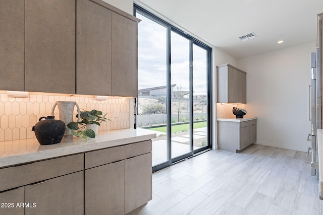 interior space with light hardwood / wood-style flooring and expansive windows