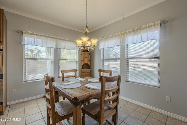 dining room featuring light tile patterned flooring, an inviting chandelier, and crown molding