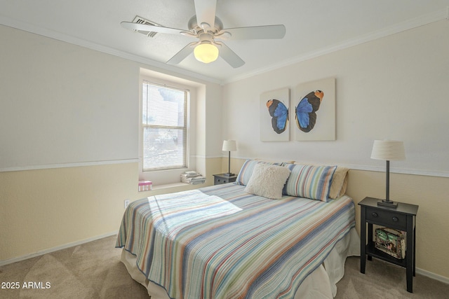 carpeted bedroom with ceiling fan and ornamental molding