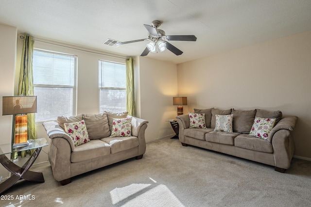 living room featuring ceiling fan and light colored carpet