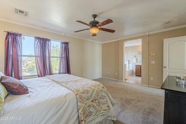 bedroom featuring ceiling fan, ensuite bathroom, light carpet, and ornamental molding