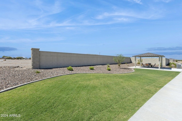 view of yard with a patio area, fence, and a gazebo