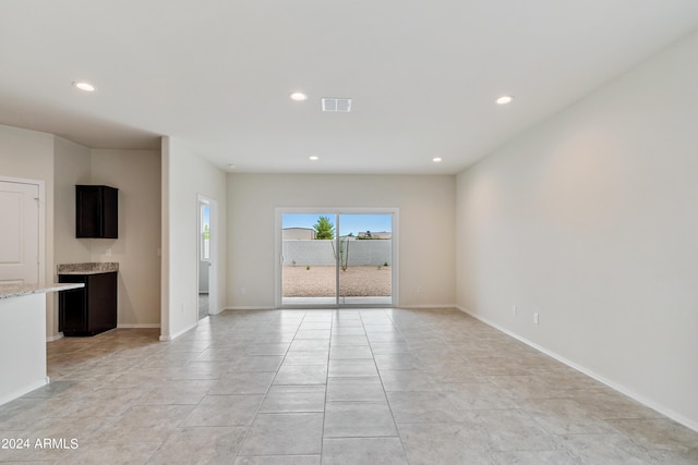 unfurnished room featuring recessed lighting, visible vents, baseboards, and light tile patterned flooring