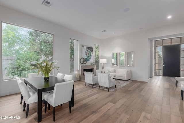 dining area with light hardwood / wood-style flooring