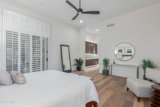 bedroom with hardwood / wood-style flooring and ceiling fan