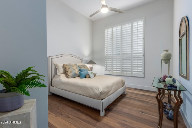 bedroom featuring dark wood-type flooring and ceiling fan