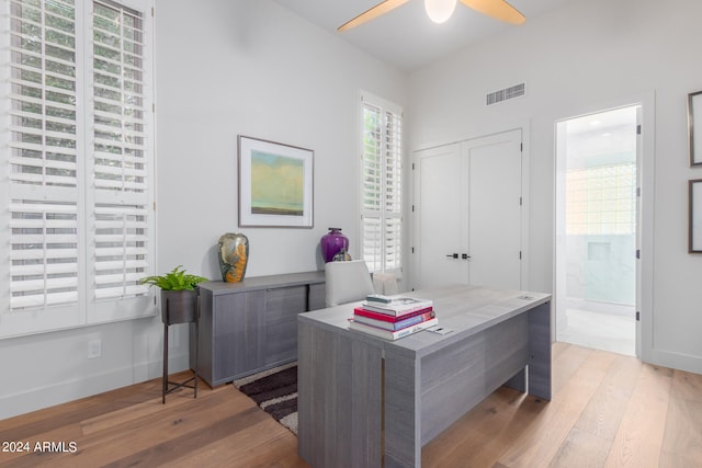 office area featuring light hardwood / wood-style floors and ceiling fan