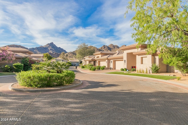 view of front of home featuring a mountain view and a garage