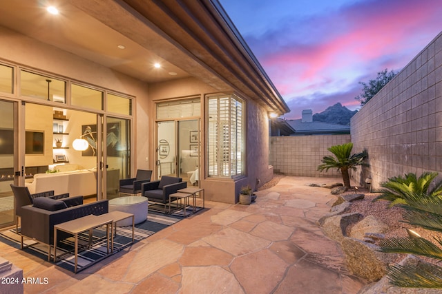 patio terrace at dusk with an outdoor hangout area