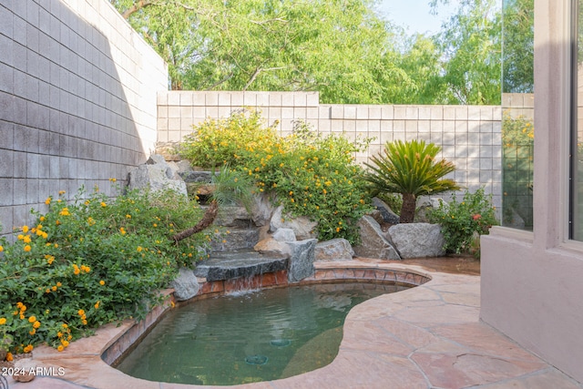 view of pool featuring pool water feature