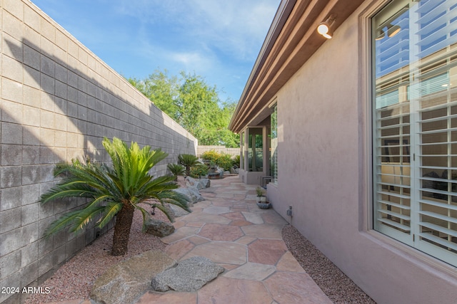 view of property exterior featuring a patio area