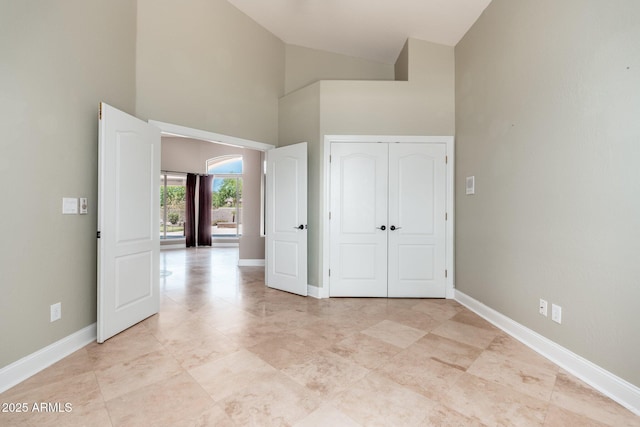 12120 E Cortez Dr, Scottsdale, AZ 85259 - unfurnished bedroom featuring high vaulted ceiling and a closet