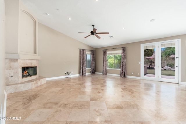 12120 E Cortez Dr, Scottsdale, AZ 85259 - unfurnished living room featuring a ceiling fan, a high end fireplace, vaulted ceiling, and recessed lighting