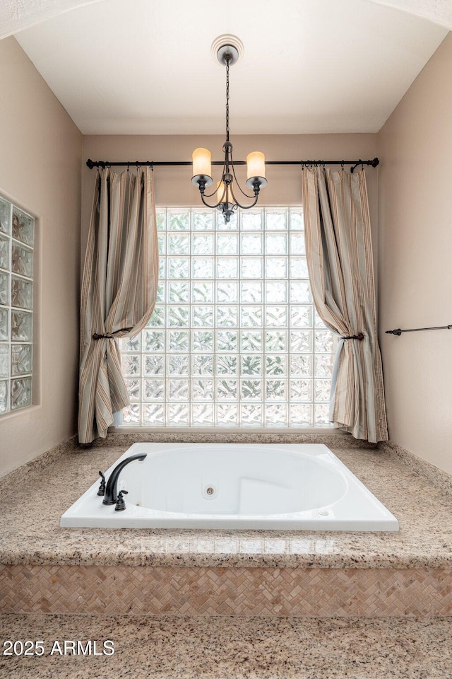 12120 E Cortez Dr, Scottsdale, AZ 85259 - full bath featuring a chandelier and a tub with jets