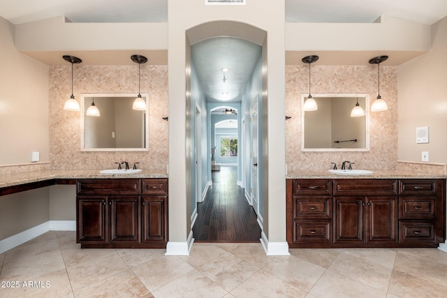 12120 E Cortez Dr, Scottsdale, AZ 85259 - full bath with tasteful backsplash, two vanities, and tile patterned floors