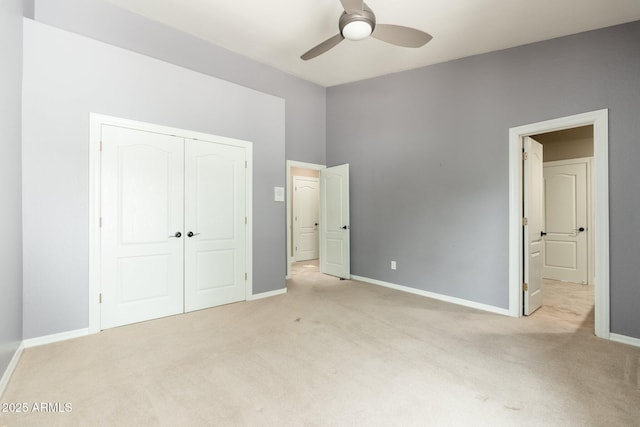 12120 E Cortez Dr, Scottsdale, AZ 85259 - unfurnished bedroom with light carpet, a closet, and a ceiling fan