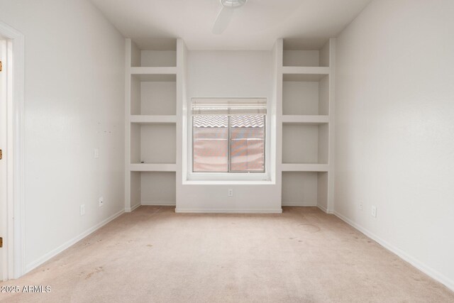 12120 E Cortez Dr, Scottsdale, AZ 85259 - spare room with carpet flooring, a ceiling fan, and built in shelves