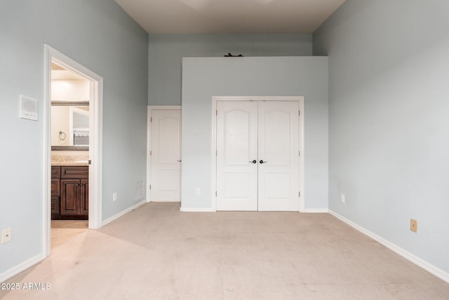 12120 E Cortez Dr, Scottsdale, AZ 85259 - unfurnished bedroom with light colored carpet, a closet, and ensuite bath