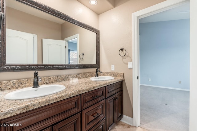 12120 E Cortez Dr, Scottsdale, AZ 85259 - bathroom featuring double vanity and baseboards