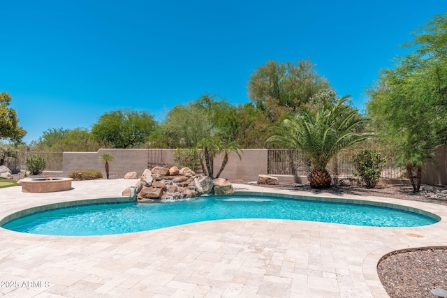 12120 E Cortez Dr, Scottsdale, AZ 85259 - view of swimming pool featuring an outdoor fire pit, a patio area, and a fenced backyard