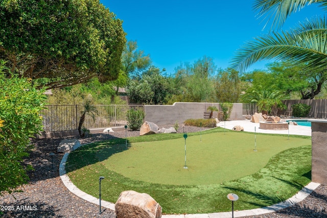 12120 E Cortez Dr, Scottsdale, AZ 85259 - fenced backyard featuring an area to practice putting and a patio