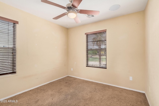 22123 E Via Del Palo, Queen Creek, AZ 85142 - carpeted spare room with baseboards, a ceiling fan, and visible vents