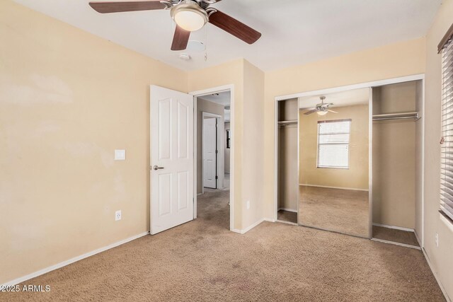 22123 E Via Del Palo, Queen Creek, AZ 85142 - unfurnished bedroom with carpet flooring, a ceiling fan, baseboards, and a closet