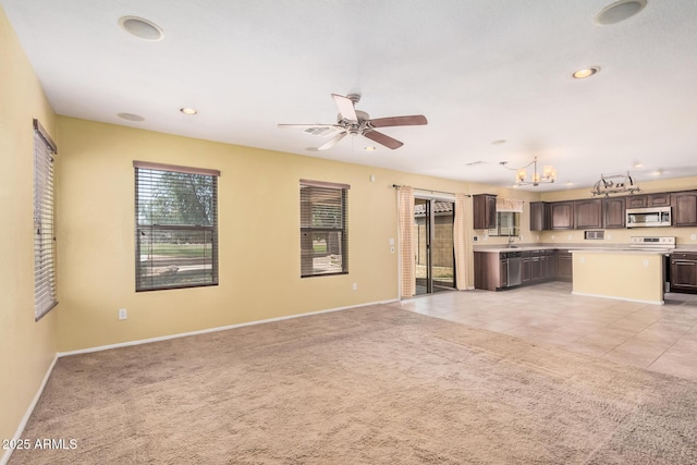 22123 E Via Del Palo, Queen Creek, AZ 85142 - unfurnished living room with baseboards, recessed lighting, ceiling fan with notable chandelier, and light carpet